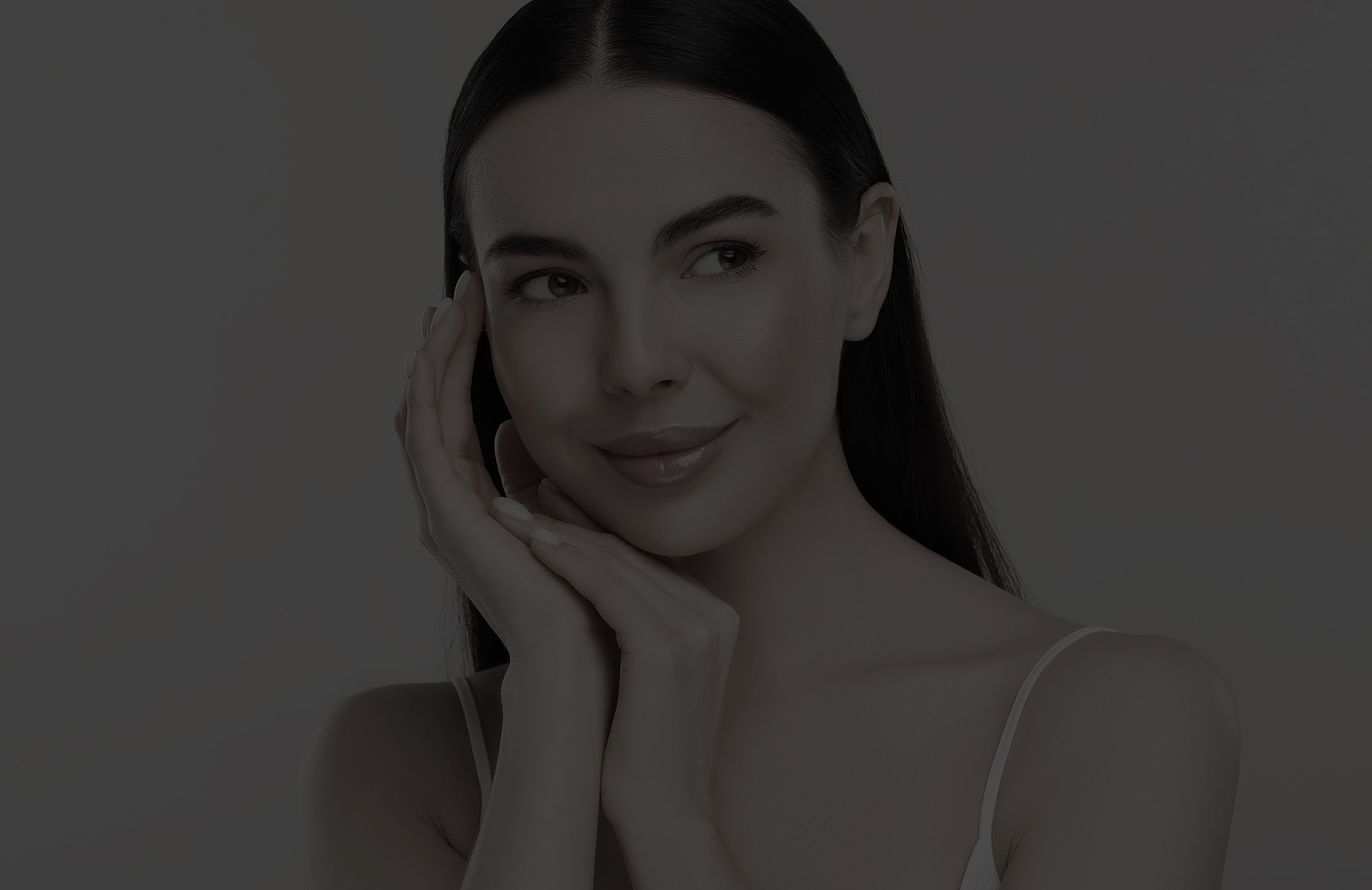 Atlanta earlobe repair model with long hair touching her face.