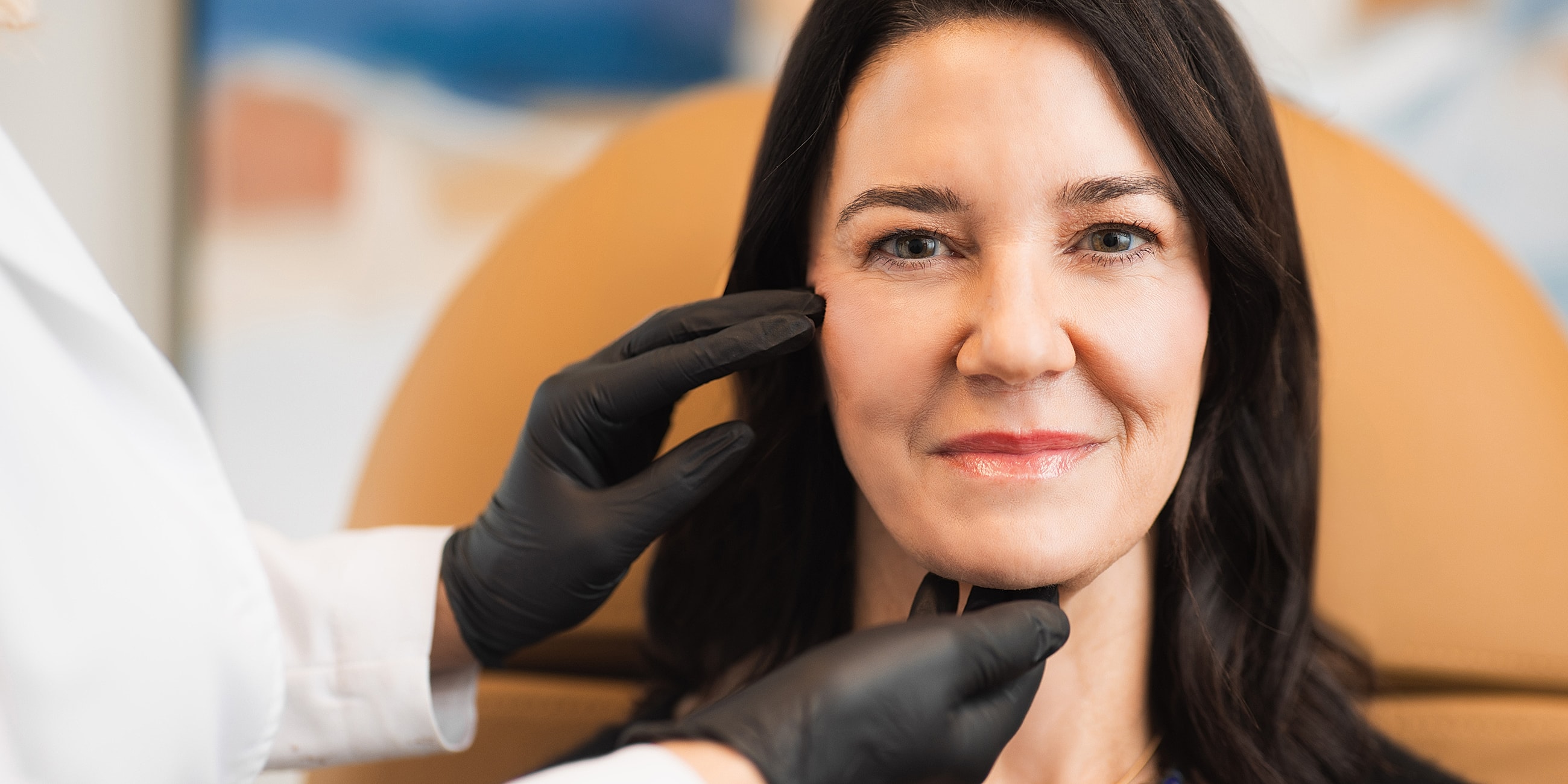 Atlanta facial balancing model receiving skincare treatment in clinic.